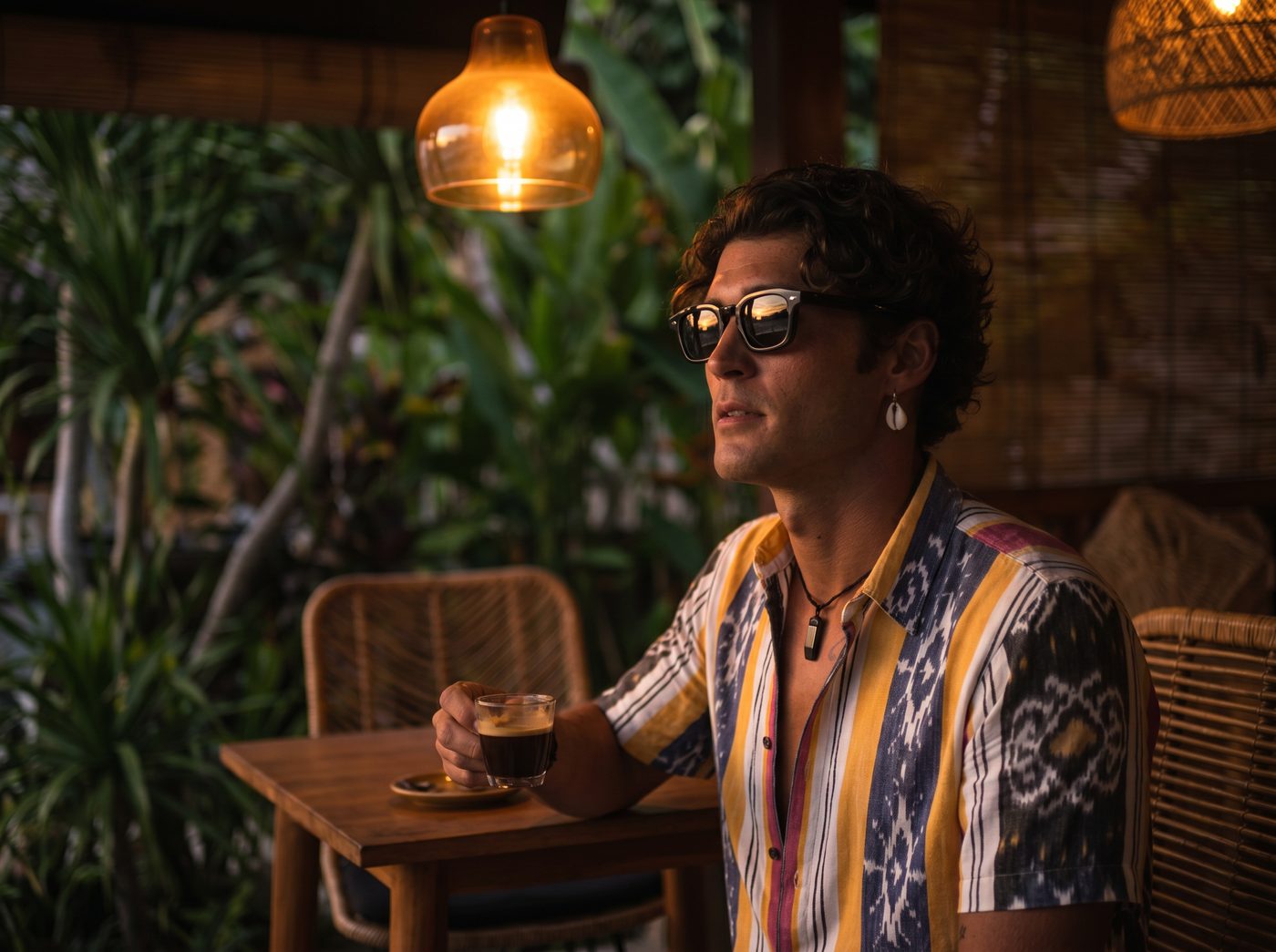 Lifestyle eyewear shoot — Arthod Eyewear frames at a Bali warung at dusk